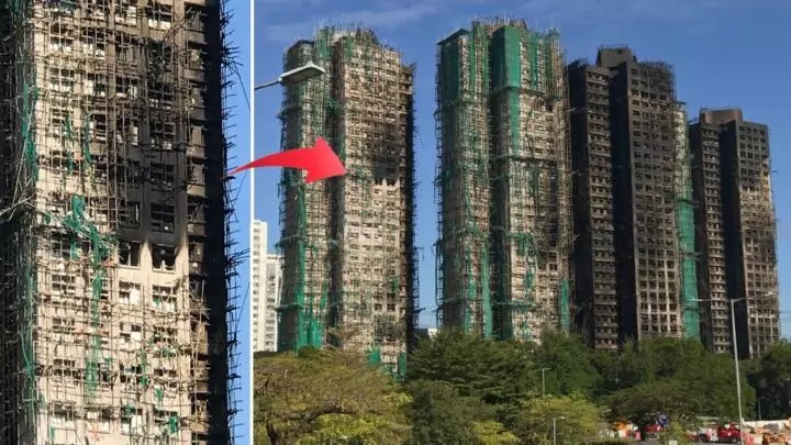 Melted green mesh on Wang Fuk Court towers; bamboo scaffold remains largely intact.
