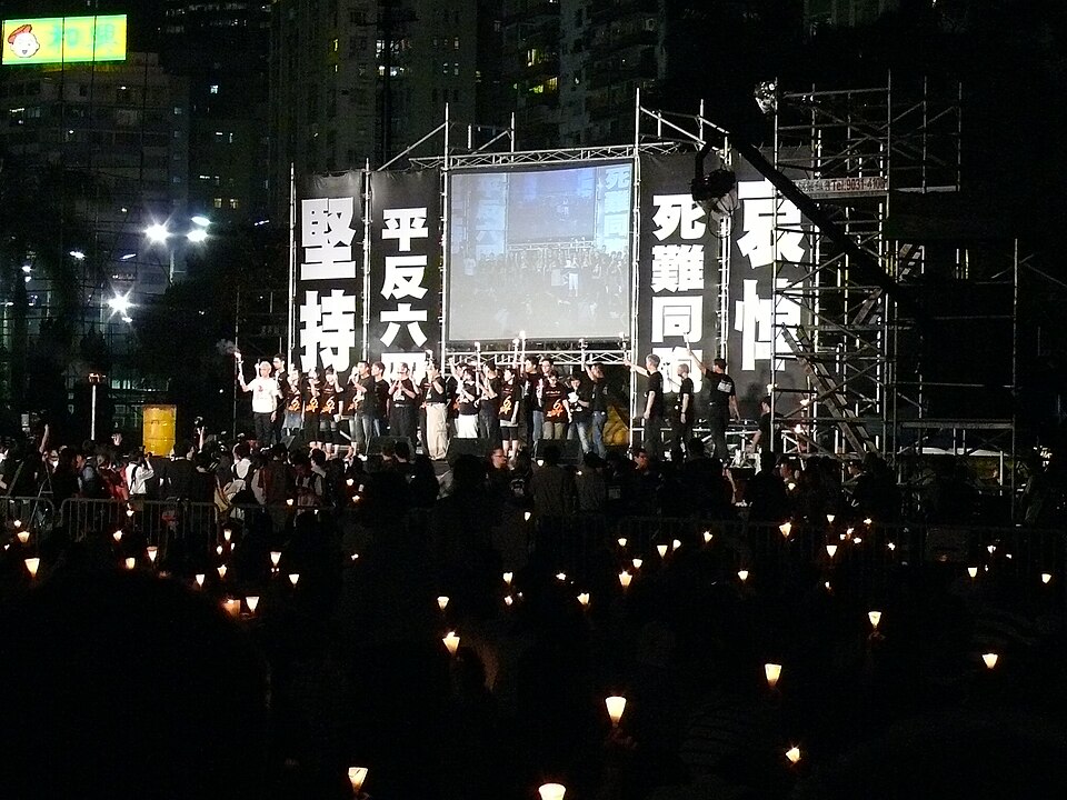 The vigil stage and candlelit crowd at night, 2008